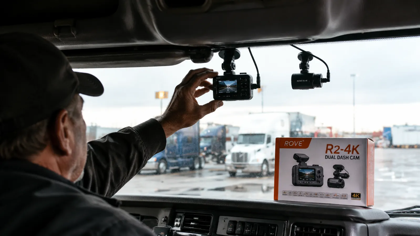 ROVE R2-4K dual dash cam mounted on a semi truck windshield showing front and rear camera units