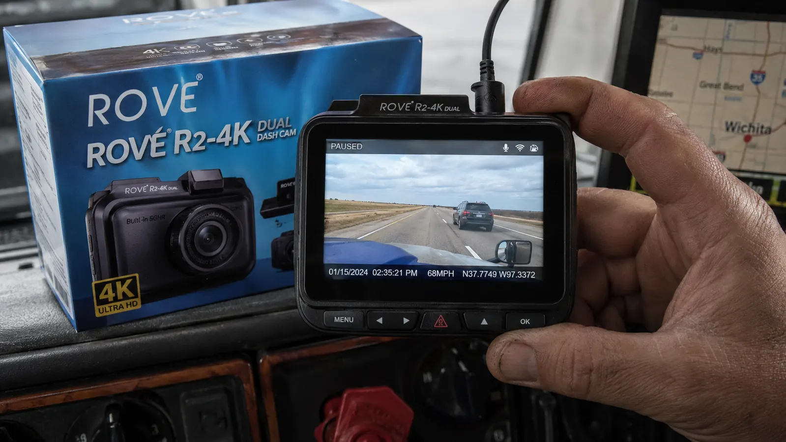 Dash cam LCD playback screen showing timestamped road footage from a highway incident