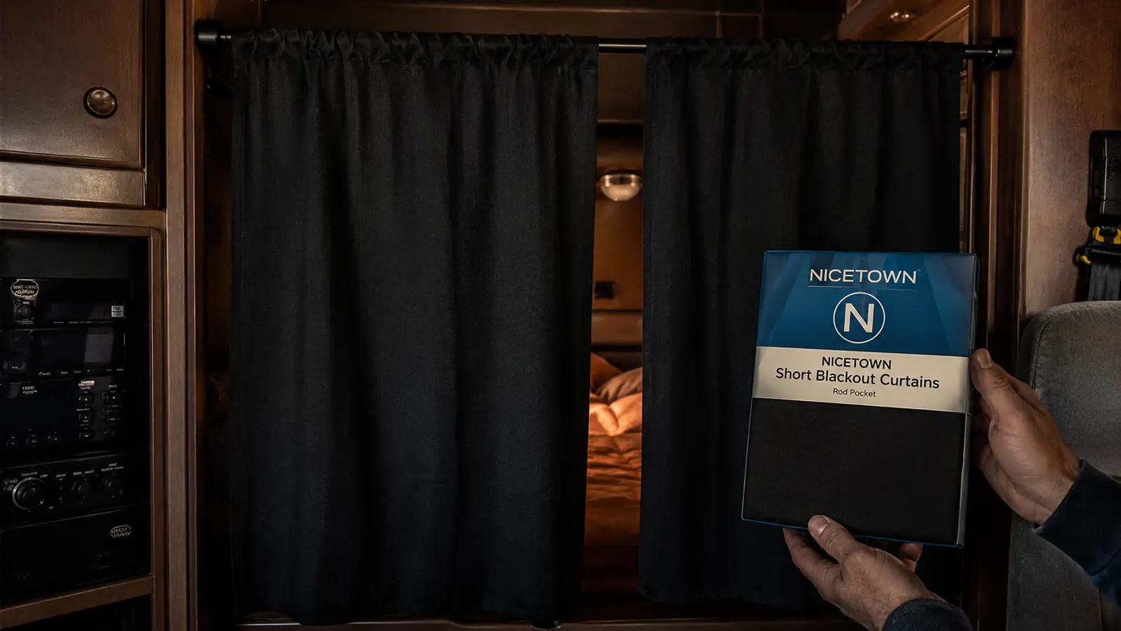 NICETOWN blackout curtain panels hung on a rod across a sleeper cab divider, blocking the bunk from the cab